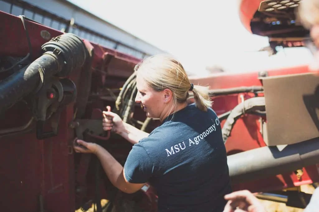 FarmHer in Michigan working on a tractor