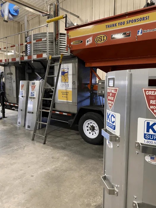 The grain bin rescue tube from KC supply is shown in front of the rescue demonstration setup