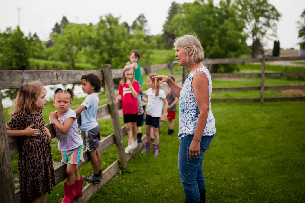 Heather Norman gives her students instructions for their day at Kinderfarm Preschool