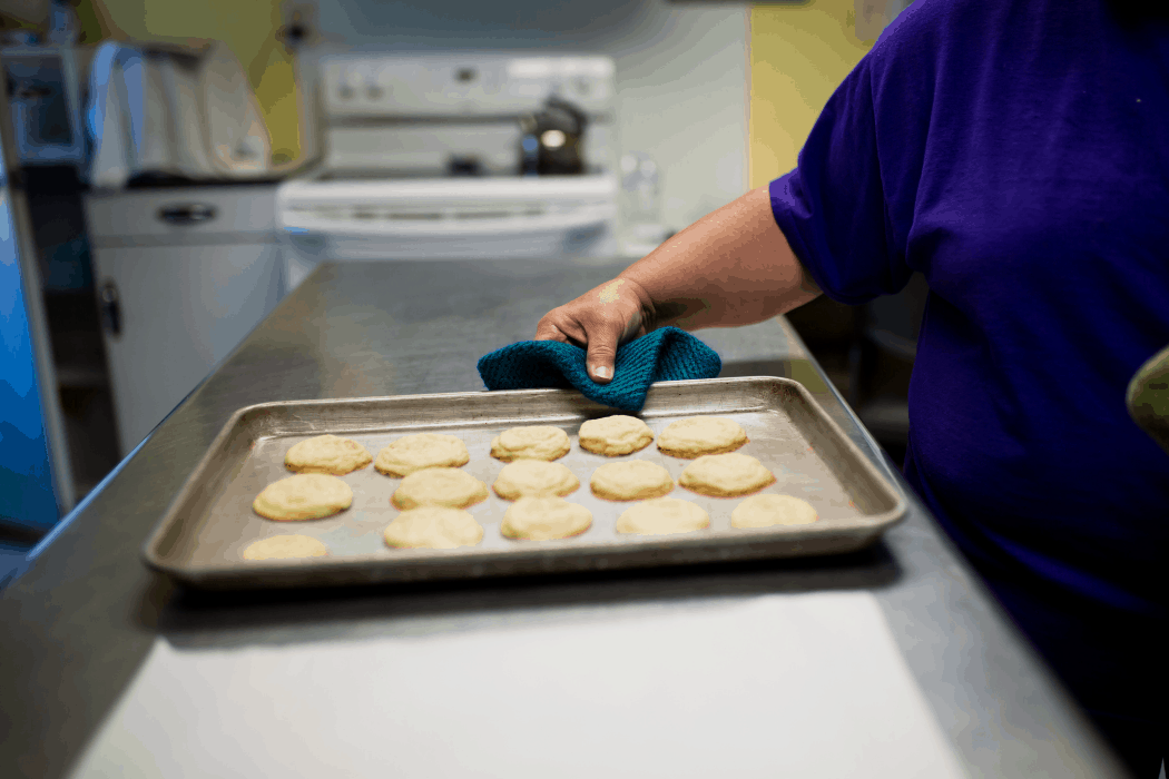 Mary Hamer takes out her "almost world famous" lavender cookies out of the oven.
