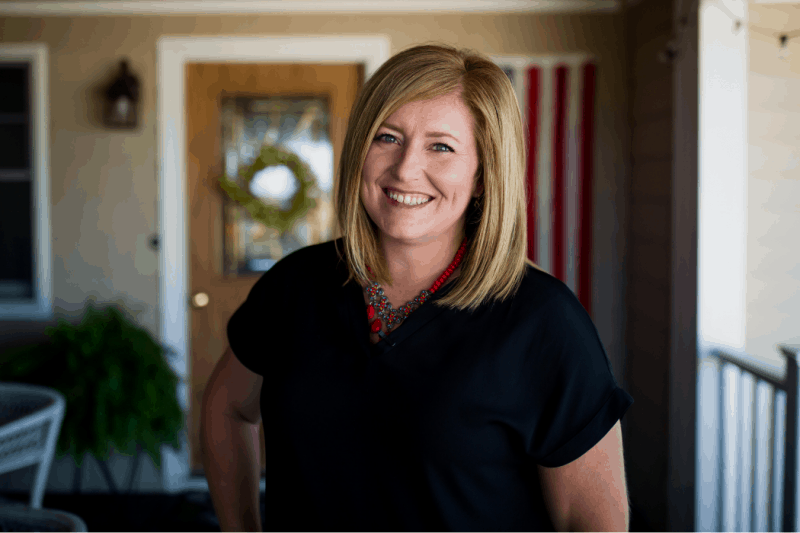 Holly Spangler stands in front of her family's home in Illinois.