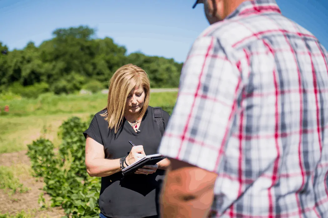 Holly Spangler interviews a local farmer for her job with Prairie Farmer magazine. 