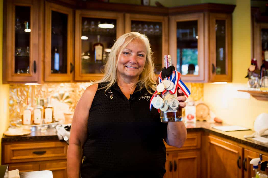 Liz Henry of J. Henry & Sons bourbon in her tasting room in Wisconsin. 