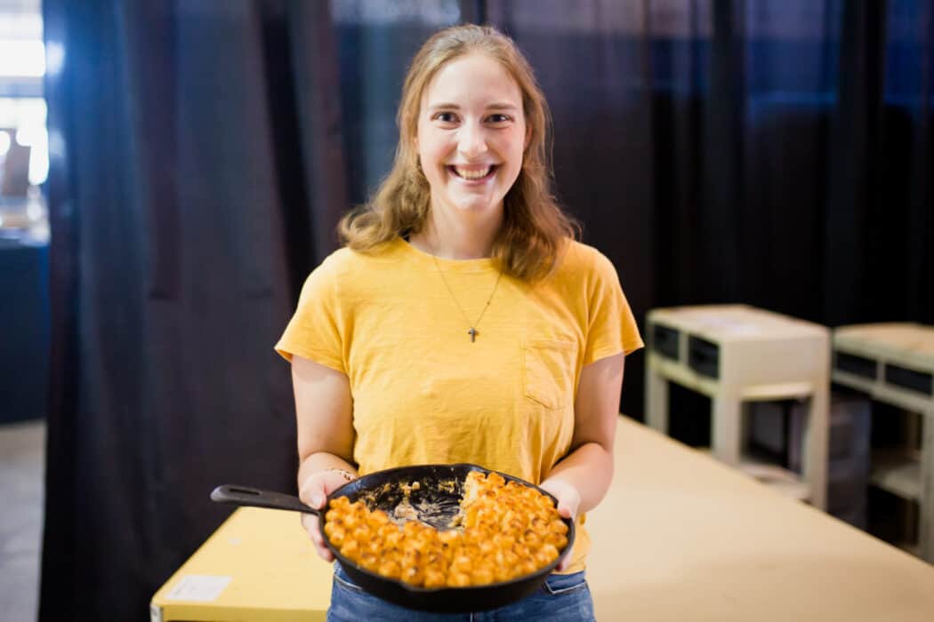 Winner of the Food Bank of Iowa Chopped- Hot Dish Edition contest, Olivia Smith, holding her casserole after winning first place. 