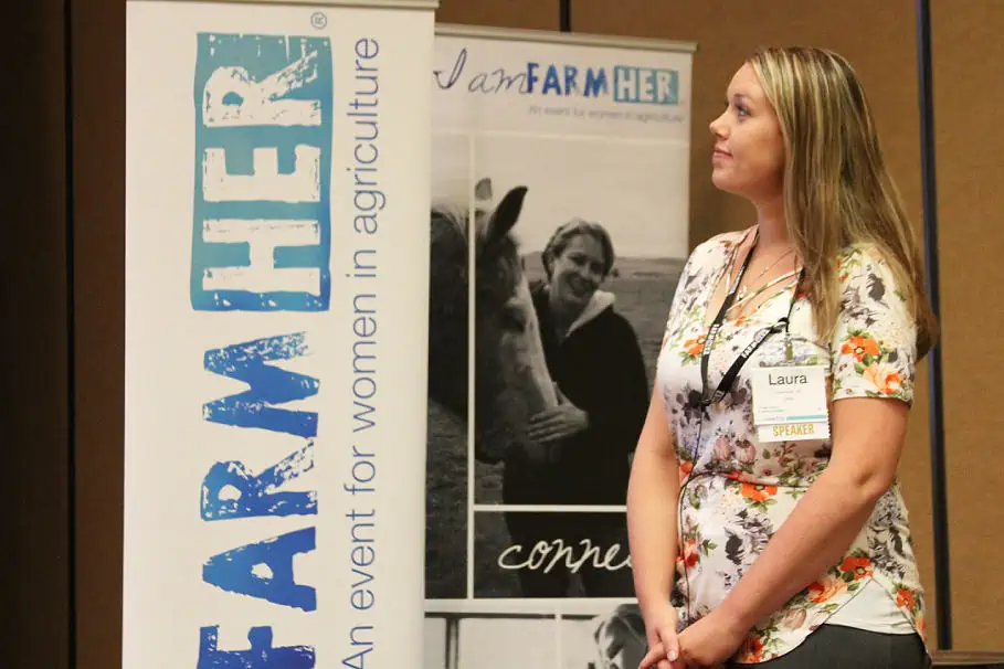 A woman standing at a FarmHer event