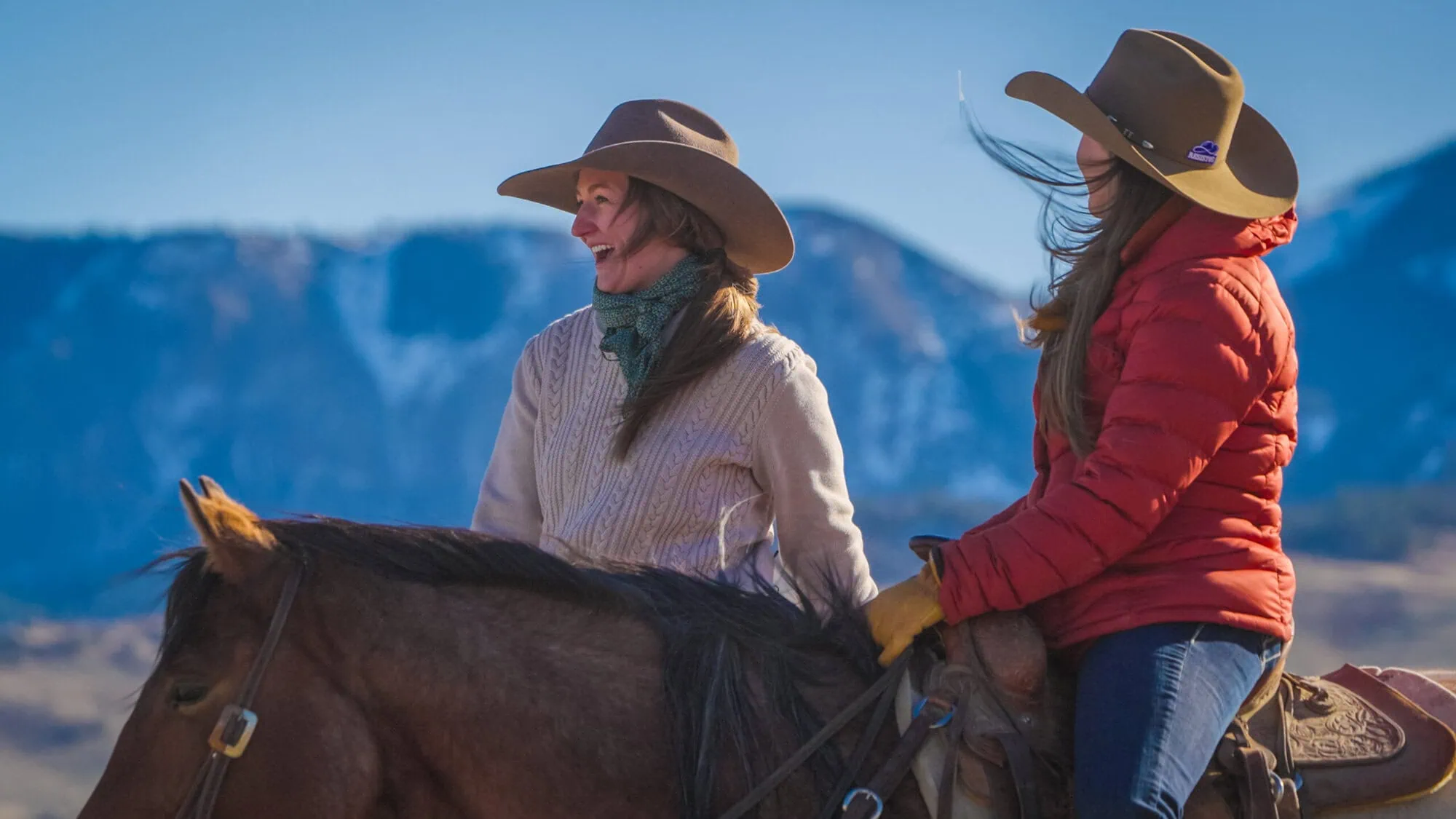 RanchHER Lindsey Anson and TV Host Janie Johnson on horseback at Pitchfork Ranch in Wyoming while filming RanchHER Season Two.